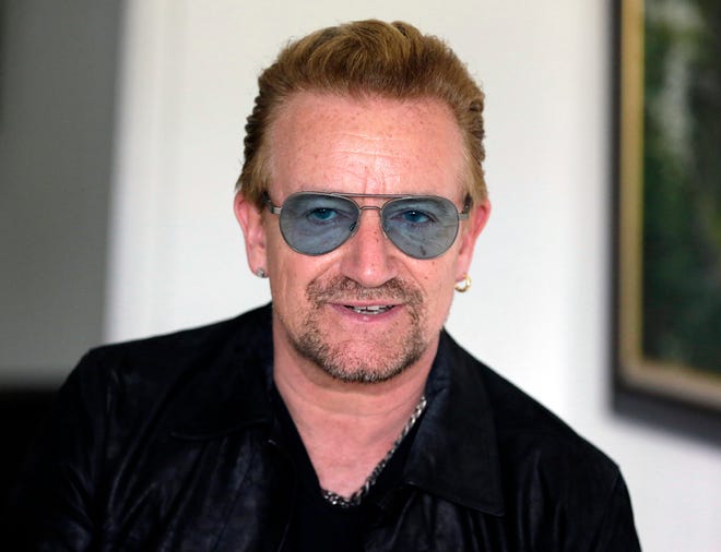 In this Friday, Aug. 28, 2015, file photo, Irish rock star Bono speaks during an interview with The Associated Press in Lagos, Nigeria. Bono is a launching an all-star campaign featuring "once-in-a-lifetime experiences" that can be won after donating at least $10 to his organization (RED), which raises funds to fight AIDS. The campaign kicks off Tuesday, Dec. 1, 2015, to coincide with World AIDS Day, which is Dec. 1. (AP Photo/Sunday Alamba, File)