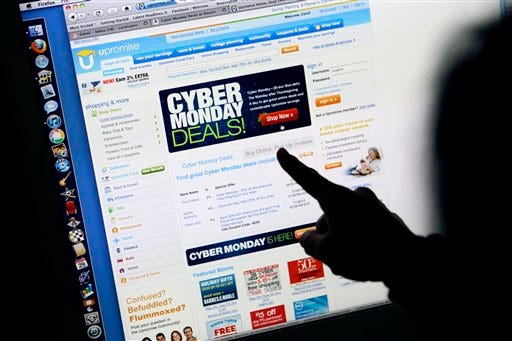 A consumer looks at Cyber Monday sales on her computer at her home in Palo Alto, Calif. Retailers are rolling out online deals on so-called "Cyber Monday." But now that shoppers are online all the time anyway, the 10-year-old shopping holiday is losing some of its luster. (AP Photo/Paul Sakuma, File)