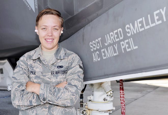 Airman 1st Class Emily Peil, 33rd Aircraft Maintenance Squadron crew chief, stands with the jet that bears her name at Eglin Air Force Base, Oct. 8. Peil is one of the first crew chiefs to begin her career on the fifth generation F-35A Lightning II straight from technical school.