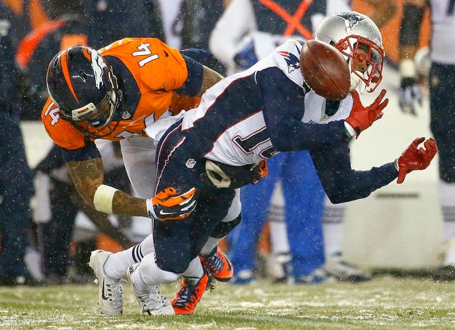 New England Patriots' Chris Harper fumbles on a punt return as Denver Broncos' Cody Latimer defends during the second half of an NFL football game, Sunday, Nov. 29, 2015, in Denver. The Broncos recovered the ball.