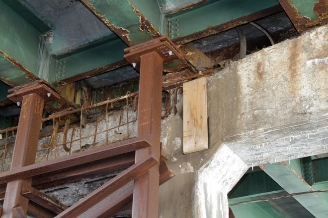 The underside of the 6-10 Connector, with a piece of plywood on a concrete beam, shows the decay below the surface of the roadway. The Providence Journal/Sandor Bodo