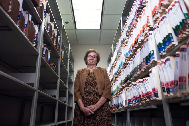 Winnebago County Coroner Sue Fiduccia stands among two and a half years of files on Wednesday, Nov. 25, 2015, at her office. Fiducciais a finalist for the 2015 Excalibur Award. SUNNY STRADER/STAFF PHOTOGRAPHER/RRSTAR.COM
