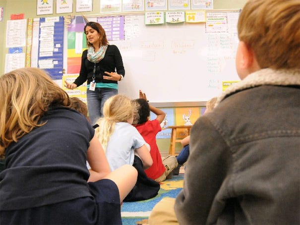 Mariel Bonilla teaches her first-grade Spanish class at Forest Hills Elementary School. New Hanover County Schools is looking at rethinking the magnet schools in the district.