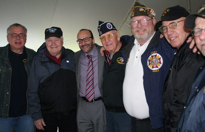 Joe Suresky, third from left, is surrounded by veterans who couldn't thank him enough for the outstanding "Tribute to Veterans" event he has hosted for the third consecutive year on Veterans Day. BARBARA BEDELL/Times Herald-Record