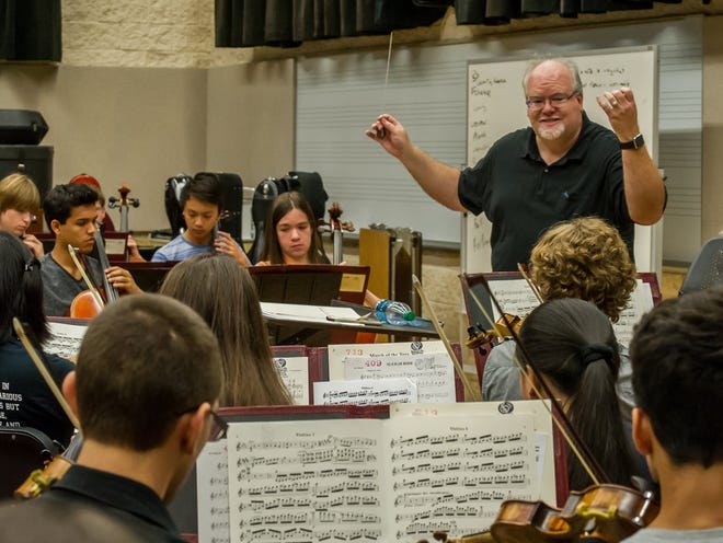 Scott Gregg, Music Director and Principal Conductor for the Jacksonville Symphony Youth Orchestra directs the more experienced Philharmonic young musicians as the JSYO rehearses at FSCJ for their Holiday Concert at the Times Union Center. Sunday November 15, 2015.