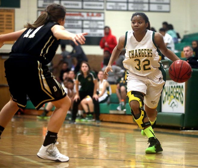 Crest’s Tamara Adams, 32, looks for an opening to get past Draughn Abi Norris during Tuesday’s SMAC contest at Ed Peeler Gym. Draughn topped the Lady Chargers, 62-54.
