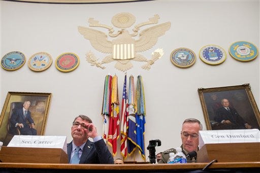 Defense Secretary Ash Carter, left, and Joint Chiefs Chairman Gen. Joseph Dunford Jr., appear on Capitol Hill in Washington, Tuesday, Dec. 1, 2015, before the House Armed Services Committee hearing on the U.S. Strategy for Syria and Iraq and its Implications for the Region. (AP Photo/Andrew Harnik)