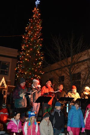 Children in the audience were invited to join the choir and sing Christmas carols after the tree was lit Friday night in downtown Mount Shasta.