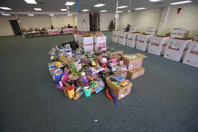 Empty areas, normally filled up with donated toys for the local Marine Corps Reserve Toys For Tots program, are shown where there is a shortage of toys for Christmas and the holiday season at a toy collection area on Southwest College Road.