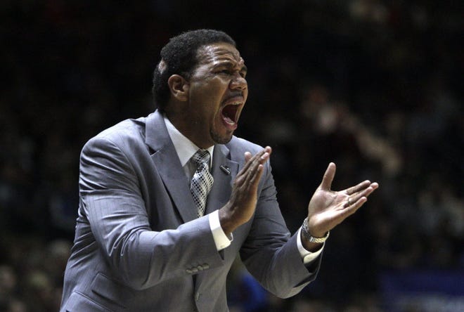 PC coach Ed Cooley trying to rally his team in the first half of PC's game vs. URI in 2013. at the Ryan Center. Cooley believes PC and URI should play all their games at The Dunk.