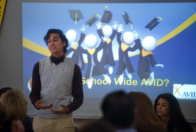 Edison High student Julio Manzo, 16, talks about the school to school administrators from around the state visiting Wednesday during a tour of Edison's AVID program. CLIFFORD OTO/THE RECORD