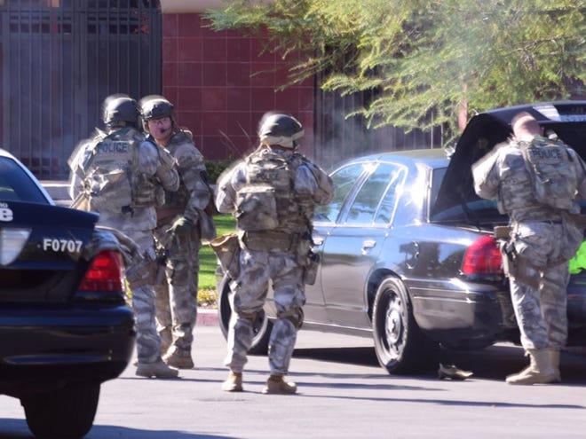 A swat team arrives at the scene of a shooting in San Bernardino, Calif. on Wednesday, Dec. 2, 2015. Police responded to reports of an active shooter at a social services facility. (Doug Saunders/Los Angeles News Group via AP)