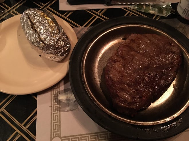 A medium filet with a baked potato at The Old Luxemburg Inn.