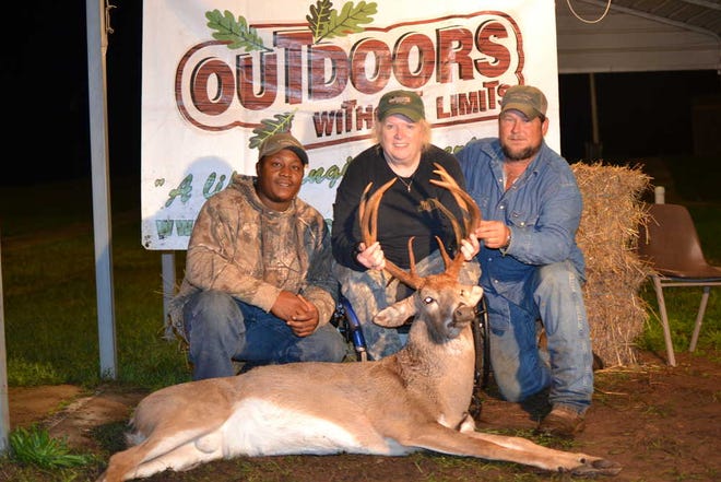Kris Ann Alexander, of Comer, killed this giant 13-point buck on the Outdoors Without Limits (OWL) hunt in Madison County. She is pictured with landowner Cory Clements (left) and guide Henry Mack.