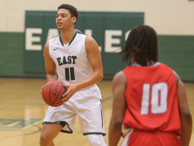 East Henderson's Malik Alston squares up to shoot a 3-pointer during the Eagles' game on Dec. 1 against Hendersonville at East. DEAN HENSLEY/ TIMES-NEWS