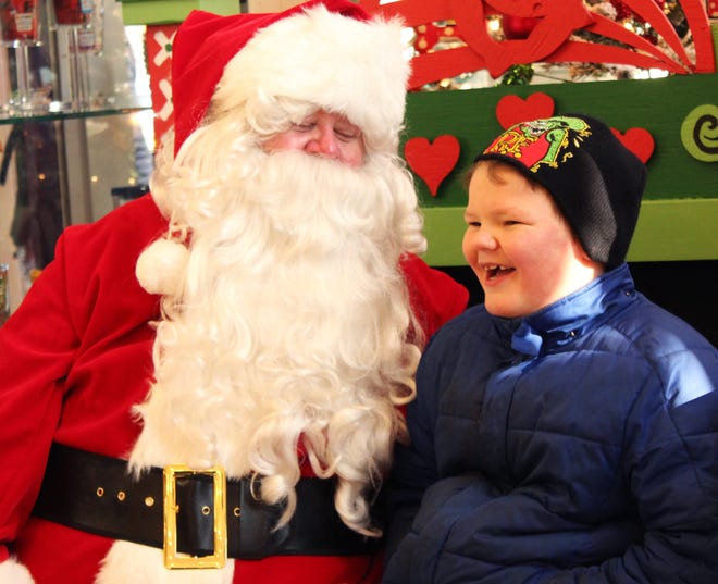 Donovan Lewis chats with Santa in Home & Company in 2013. Sentinel File.