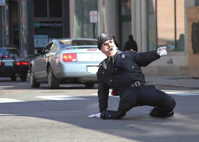 Tony Lepore, the "Dancing Cop," directs traffic in Providence.