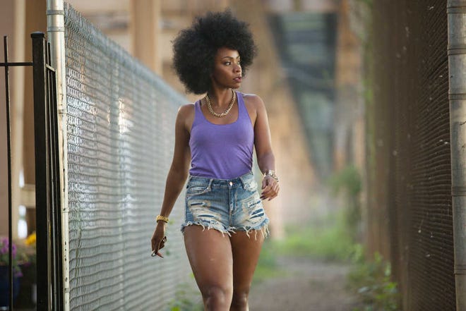 This photo provided by Roadside Attractions and Amazon Studios shows Teyonah Parris as Lysistrata in Spike Lee's film, "Chi-Raq." The movie opens in U.S. theaters on Dec. 4, 2015. (Parrish Lewis/Roadside Attractions/Amazon Studios via AP)