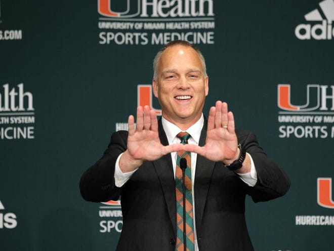 Mark Richt gestures after being introduced as the new University of Miami NCAA college football head coach, Friday, Dec. 4, 2015, in Coral Gables.