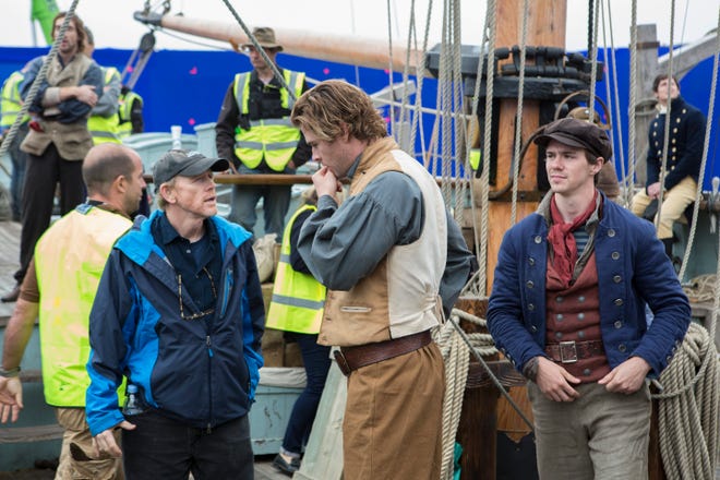 Ron Howard discusses a scene with Chris Hemsworth during the shooting of "In the Heart of the Sea." (Warner Bros.)