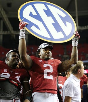 Alabama running back Derrick Henry celebrates after the second half of the Southeastern Conference championship NCAA college football game against Florida, Saturday, Dec. 5, 2015, in Atlanta. Alabama won 29-15. (AP Photo/John Bazemore)