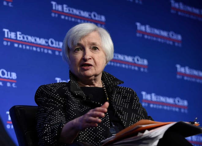 Federal Reserve Chair Janet Yellen speaks at the Economics Club of Washington in Washington, Wednesday, Dec. 2, 2015. Yellen indicated that the U.S. economy is on track for an interest rate hike this month, but the Fed will need to review incoming data before making a final decision. (AP Photo/Susan Walsh)