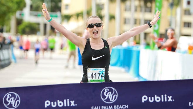 Amanda Jacob wins the women's division of the Palm Beach Marathon and Run Fest.