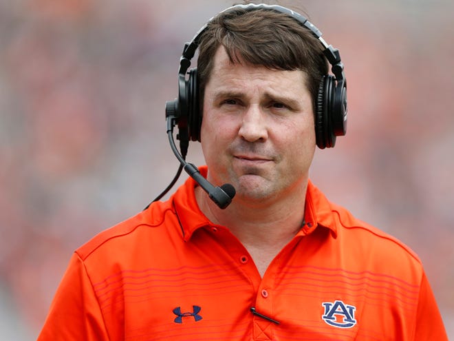 In this April 18, 2015, file photo, Auburn defensive coordinator Will Muschamp walks around the football field in the first quarter of their spring NCAA college football game in Auburn, Ala. A person with direct knowledge of the decision says Muschamp has agreed to become South Carolinaâ€™s next head football coach, and he could be formally introduced as early as Monday, Dec. 7, 2015. (AP Photo/Brynn Anderson, File)