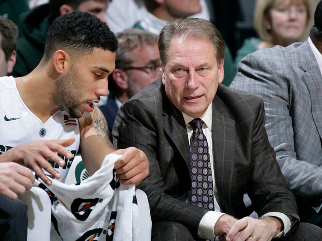 Michigan State coach Tom Izzo, right, talks to Denzel Valentine during the second half of an NCAA college basketball game against Arkansas-Pine Bluff, Friday, Nov. 20, 2015, in East Lansing, Mich.