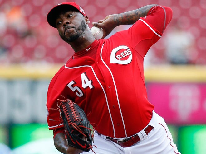 In this Sept. 7, 2015, file photo, Cincinnati Reds relief pitcher Aroldis Chapman throws in the ninth inning of a baseball game against the Pittsburgh Pirates, in Cincinnati. A person familiar with the deal says the Reds have agreed to trade hard-throwing reliever Aroldis Chapman to the Los Angeles Dodgers, pending approval of medical records.