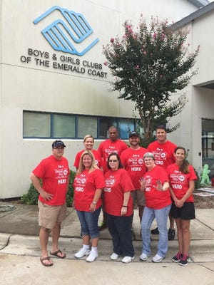 Hancock Bank employees from around the Emerald Coast team up for the recent United Way Day of Giving at the Boys and Girls Club of the Emerald Coast.