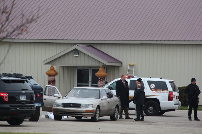 A suspect in a double homicide committed suicide in his vehicle, a gold Lexus sedan in front of the Lao Buddhist Temple of Holland in Olive Township, as seen Tuesday, Dec. 8. Amy Biolchini/Sentinel Staff