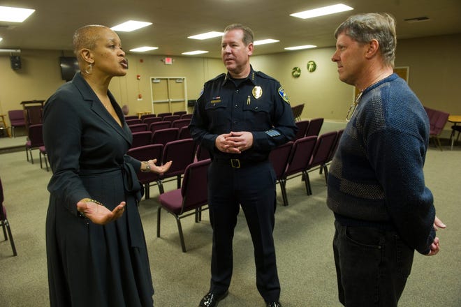 Tracie Keesee, project director of the National Initiative for Building Community Trust and Justice, left, talks with Stockton Police Chief Eric Jones and police chaplain Kevin White before a Tuesday meeting at the Lighthouse of the Valley Church in Stockton. CLIFFORD OTO/THE RECORD