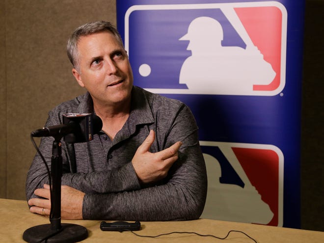 Cincinnati Reds manager Bryan Price talks with reporters at the Major League Baseball winter meetings Monday, Dec. 7, 2015, in Nashville, Tenn.