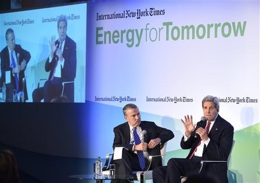 US Secretary of State John Kerry speaks with New York Times columnist Thomas Friedman, left, during the International New York Times Energy for Tomorrow Conference at the Hotel Potocki in Paris, France, Dec. 9, 2015 on the sidelines of the COP21 United Nations conference on climate change. (AP Photo/Mandel Ngan, Pool via the AP)