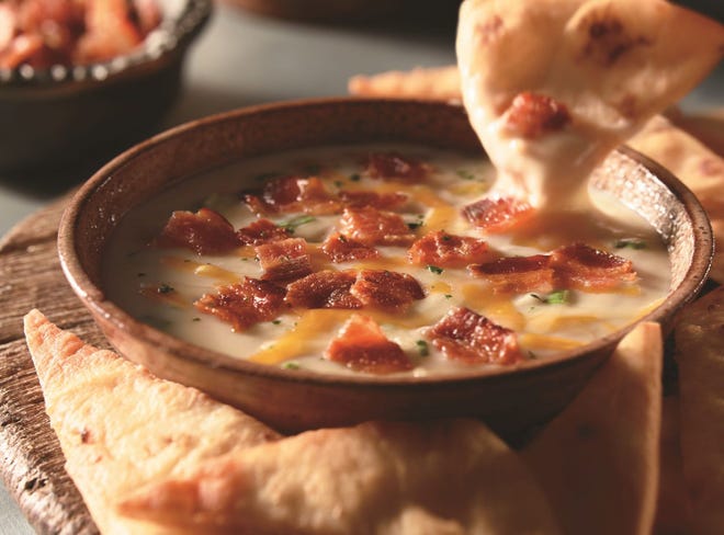 Longhorn Steakhouse's White Cheddar and Bacon Dip is one of the selections available from the new Winter Peak Season menu.