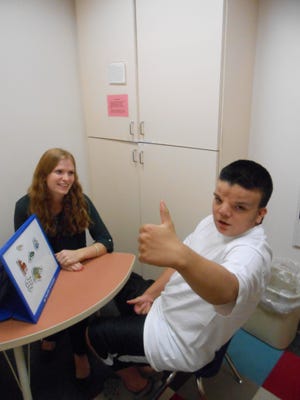 Graduate clinician Ashley Schoonover with Dominick, who has been receiving services at the Stockton Scottish Rite Language Disorders Center since summer 2014. Since he started receiving services at the center, his word use has increased from 15 words to 40 and he has produced his first sentences, and is now willing to speak out in public, his mother says. COURTESY