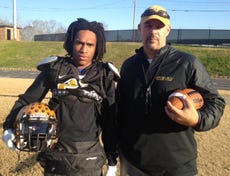 Shelby High senior corner Demonte Poole, left, is one of the leaders for the Golden Lions in the secondary for position coach Brad Causby, right. Poole has 12 interceptions this season as Shelby heads into Saturday’s 2A title matchup with Kinston in Raleigh. It will be the final game for Causby after a 25-year coaching career, the last six at Shelby.