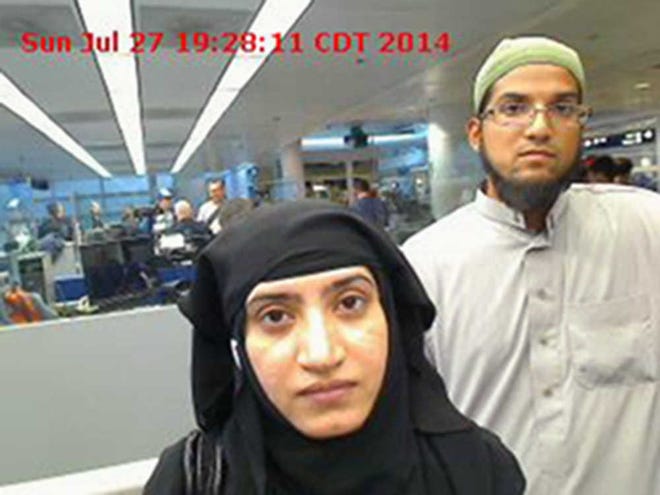 This July 27, 2014 photo provided by U.S. Customs and Border Protection shows Tashfeen Malik, left, and Syed Farook, as they passed through O'Hare International Airport in Chicago. The husband and wife died on Dec. 2, 2015, in a gun battle with authorities several hours after their assault on a gathering of Farook's colleagues in San Bernardino, Calif. (U.S. Customs and Border Protection via AP)