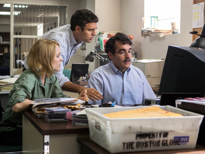 This photo provided by courtesy of Open Road Films shows, Rachel McAdams, from left, as Sacha Pfeiffer, Mark Ruffalo as Michael Rezendes and Brian d'Arcy James as Matt Carroll, in a scene from the film, "Spotlight."