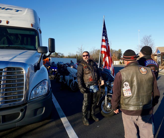 Chop Shop Pub owner Bill Niland was asked to lead the Wreaths Across America convoy through New Hampshire along with many dozens of motorcycles on Pearl Harbor Day.  The convoy is carrying 250,000 Christmas wreaths that will be placed at each grave in Arlington National Cemetery. Photo by Kiki Evans/Seacoastonline