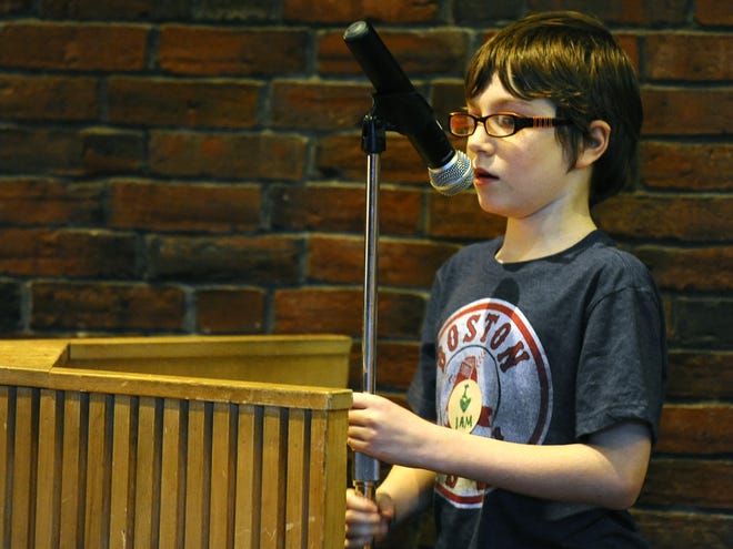 Seamus Leger, 11, who attends a prep school, urged the state Board of Elementary and Secondary Education to allow the new charter school during a hearing in the Fitchburg Public Library auditorium Thursday. T&G Staff/Christine Hochkeppel