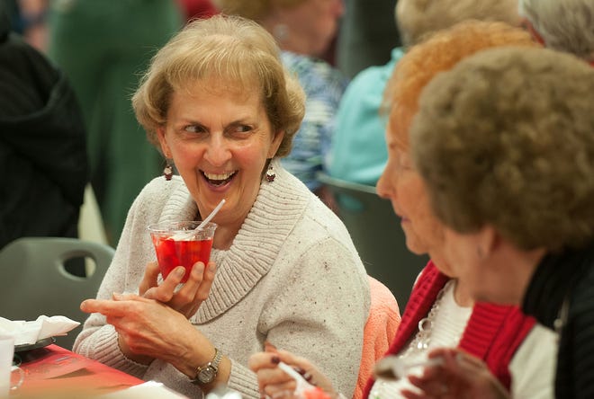 Anna Bryant (left), of Fairless Hills, enjoys her fruit cocktail and socializing with Elvira Pilla, of Middletown, and Sophia Gusina (far right), of Middletown, during the 18th annual Senior Citizen Holiday Dinner at Pennsbury High School Friday, Dec. 11, 2015, in Falls. About 200 area senior citizens attended the event, which was hosted by the PHS Interact Club.
