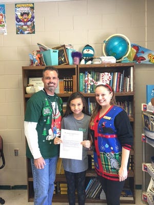 Grace Michelli is pictured with Mr. Marello, the school principal, and her ELA teacher, Mrs. Pittman.