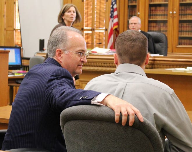 Defense Attorney Michael Honeywell (left) wraps his arm around his client Cory Mulder Friday in Ionia County Circuit Court. Mulder was just acquitted of third-degree sexual assault.

(Nicholas Grenke / Ionia Sentinel-Standard)