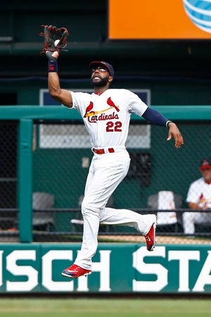 In this Sunday, July 26, 2015 file photo, St. Louis Cardinals right fielder Jason Heyward makes a leaping catch on a ball hit by Atlanta Braves' Nick Markakis during the ninth inning of a baseball game in St. Louis. A person familiar with the negotiations says the Chicago Cubs and free agent outfielder Jason Heyward have agreed to a $184 million, eight-year contract, Friday, Dec. 11, 2015.