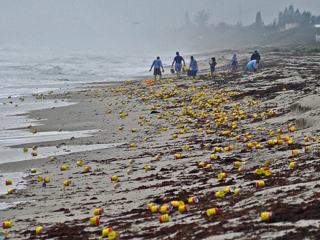 Thousands of cans and vacuum packed bricks of Cafe Bustelo brand coffee litter the beaches of Indialantic, Fla.