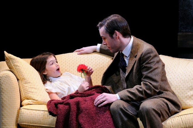 Kevin Cirone as George Bailey comforts his sick daughter, Zuzu, portrayed by Kate Rocchio, in the family-friendly holiday musical "It's a Wonderful Life," at Ocean State Theatre in Warwick through Dec. 27. Mark Turek