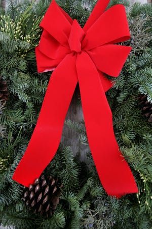 Learn how to make a holiday wreath at Bloomer's Nursery at ongoing workshops Wednesday through Sunday, through Dec. 23. (Brian Davies/The Register-Guard)