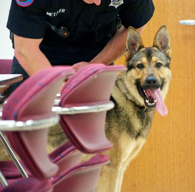 Officer Stan Metzler handles Cliff, a German Shepherd, on Monday, May 11, 2015, at the Winnebago County Criminal Justice Center. The Winnebago County Sheriff's Department has two K-9 units and hopes to add more. RRSTAR.COM FILE PHOTO